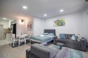 a living room with a couch and a table at Apartman Tibor in Zlatibor