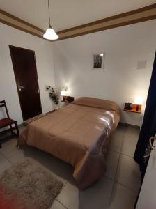 a bedroom with a large bed in a room at Espacio Verde in Salta +21 photos