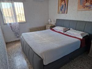 Una cama o camas en una habitación de Villa Rural Málaga Aeropuerto