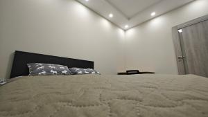 a bedroom with a large bed and a heart wall at Kavoliuko 14 in Vilnius