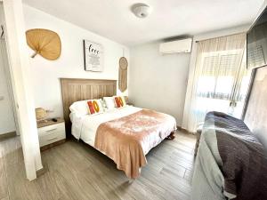 Postel nebo postele na pokoji v ubytování Iris Vistas Benalmadena
