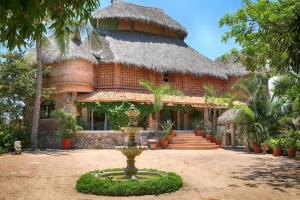 a building with a fountain in front of it at Tia Adriana in Sayulita