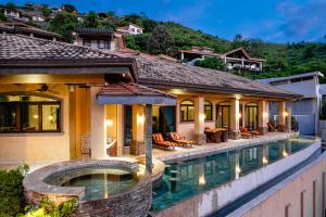 an image of a villa with a swimming pool at Casa TexVol in Playa Hermosa