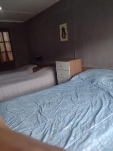 מיטה או מיטות בחדר ב-Nativos