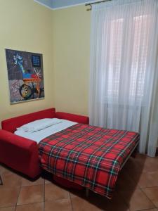 A bed or beds in a room at Nel Sole bilocale
