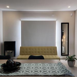 a bedroom with a large bed and a fireplace at Estepa Sur Alojamiento Gaiman in Gaiman
