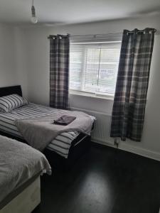Een bed of bedden in een kamer bij Guest house room 1