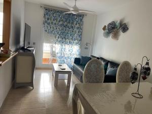 a living room with a couch and a table at Apartamento del Toyo in Almería