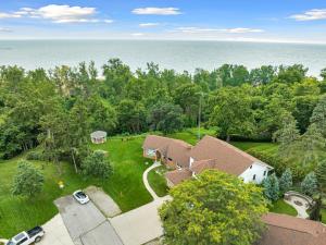 an aerial view of a house with a yard at Coastal Suite - Seacliff Beach Suites in Leamington