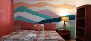Letto o letti in una camera di Whale Tail Hotel