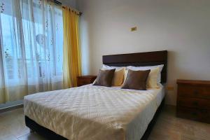 A bed or beds in a room at Estancia primavera, un espacio amplio y acogedor