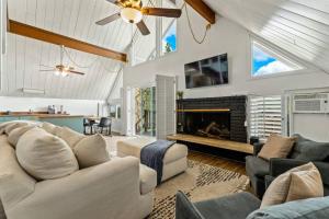 a living room with a couch and a fireplace at Peaceful North Fork Cabin w/ Fireplace & Wi-Fi! in North Fork