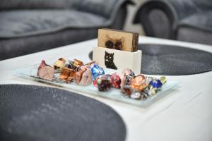 a plate of figurines on top of a table at ENA apartman in Kraljevo