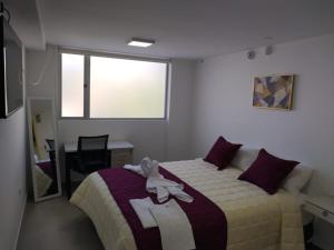 Postel nebo postele na pokoji v ubytování HOSTAL VERONA + 25 fotografií
