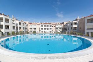 a large swimming pool in the middle of a building at Anna in Cavallino-Treporti