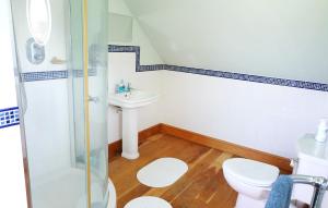 a bathroom with a shower and a toilet and a sink at The Ox House in Chewton Mendip