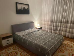 Postel nebo postele na pokoji v ubytování Apartman Dunja
