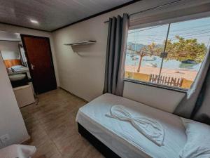 Postel nebo postele na pokoji v ubytování Pousada Porto Girassol