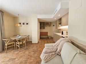 a living room with a couch and a table at Apartamentos Las Ciencias Studio Y in Valencia