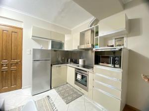 A kitchen or kitchenette at Guest-home 2