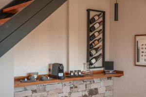 a room with a shelf with wine bottles at Agrelo Vines Lodge in Agrelo