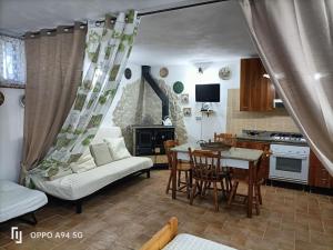 a living room with a couch and a table at La Dimora di Angela in Amendolara