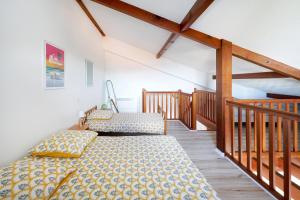 Loue Duplex De 80 M2 Vue Sur Mer客房内的一张或多张床位
