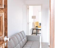 a living room with a couch and a table at Sea View Baleal in Peniche