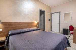 Postel nebo postele na pokoji v ubytování Hotel Ristorante La Mimosa