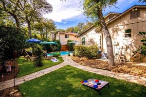 a backyard with a pool and a table at One of San Antonio's Finest in San Antonio