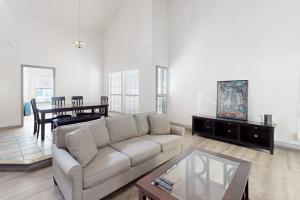 a living room with a couch and a table at Big City Living, Full Property in Dallas