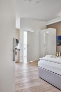 Ein Bett oder Betten in einem Zimmer der Unterkunft Boardinghotel Heidelberg
