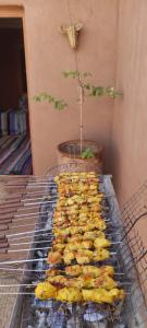 a grill with a bunch of food on it at Auberge Sahara Iriki & Désert Tours in Foum Zguid