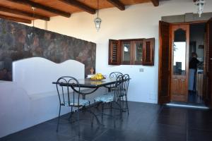 a dining room with a table and chairs at Casa Lorenzo in Stromboli