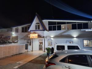 a car parked in front of a hotel room at Express Inn PTY Aeropuerto Internacional Panama in Tocumen