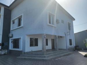a white building with stairs in front of it at Dream Stay in Brusubi