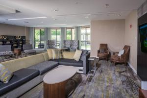 a large living room with a couch and chairs at Courtyard Bangor in Bangor