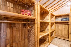 a sauna with wooden shelves in a cage at Villa Burung Gili Air Authentic 3-Bedroom Bamboo Villa with Private Pool in Gili Air