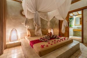 Llit o llits en una habitació de Villa Burung Gili Air