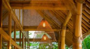 a chandelier hanging from a wooden ceiling at Villa Burung Gili Air Authentic 3-Bedroom Bamboo Villa with Private Pool in Gili Air