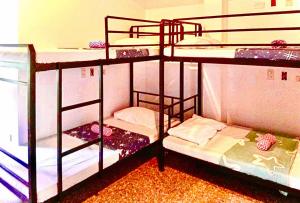 two sets of bunk beds in a room at RedDoorz @ Recson Boracay Hostel in Boracay