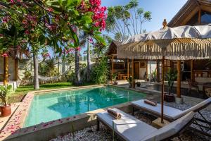 an image of a villa with a swimming pool at Villa Burung Gili Air Authentic 3-Bedroom Bamboo Villa with Private Pool in Gili Air