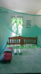 een slaapkamer met een bed in een tent bij BATAD Rita's Mount View Inn and Restaurant in Banaue