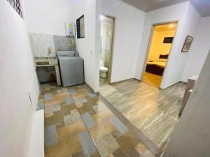 a hallway with a bathroom with a sink and a toilet at la martina in San Francisco