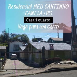 a sign that says residential mexican cantina canaciones and a house at RESIDENCIAL MEU CANTINHO in Canela