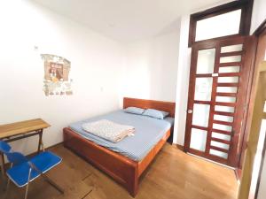 Ein Bett oder Betten in einem Zimmer der Unterkunft KENPI Homestay