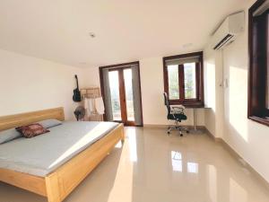 Ein Bett oder Betten in einem Zimmer der Unterkunft KENPI Homestay