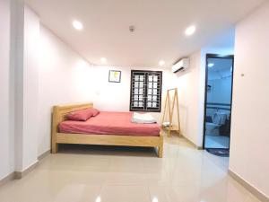 Ein Bett oder Betten in einem Zimmer der Unterkunft KENPI Homestay