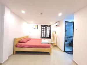 Ein Bett oder Betten in einem Zimmer der Unterkunft KENPI Homestay
