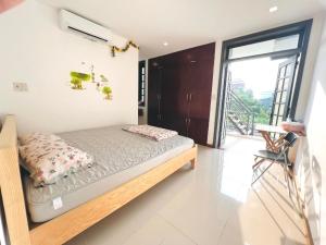 Ein Bett oder Betten in einem Zimmer der Unterkunft KENPI Homestay